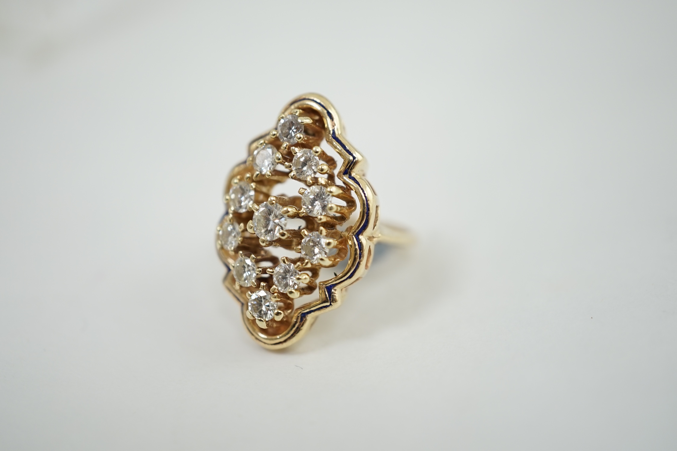 A modern gold and diamond cluster set ring